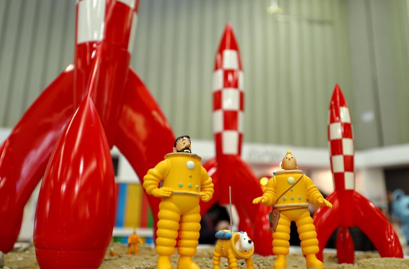 The comic figues captain Haddock (L-R), Snowy and Tintin stand next to each other at the stand of the German company Franko-Belgischer Comic-Produkte Atomax during the 69th Nuremberg International Toy Fair in Nuremberg, Germany, 31 January 2018. The largest toy fair worldwide will last between the 31st of January until the 4th of February 2018. Photo: Daniel Karmann/dpa (Photo by Daniel Karmann/picture alliance via Getty Images)