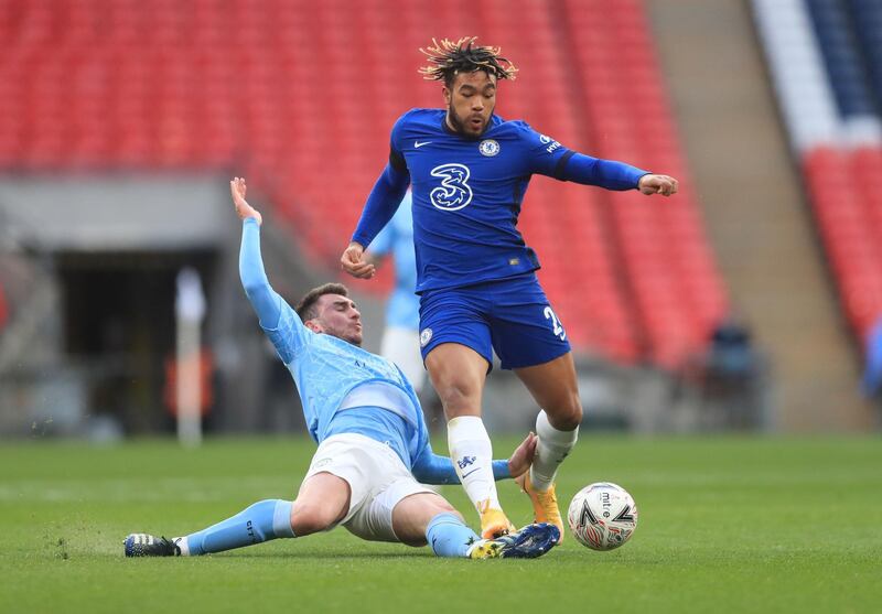 Manchester City's Aymeric Laporte challenges Reece James of Chelsea. Reuters