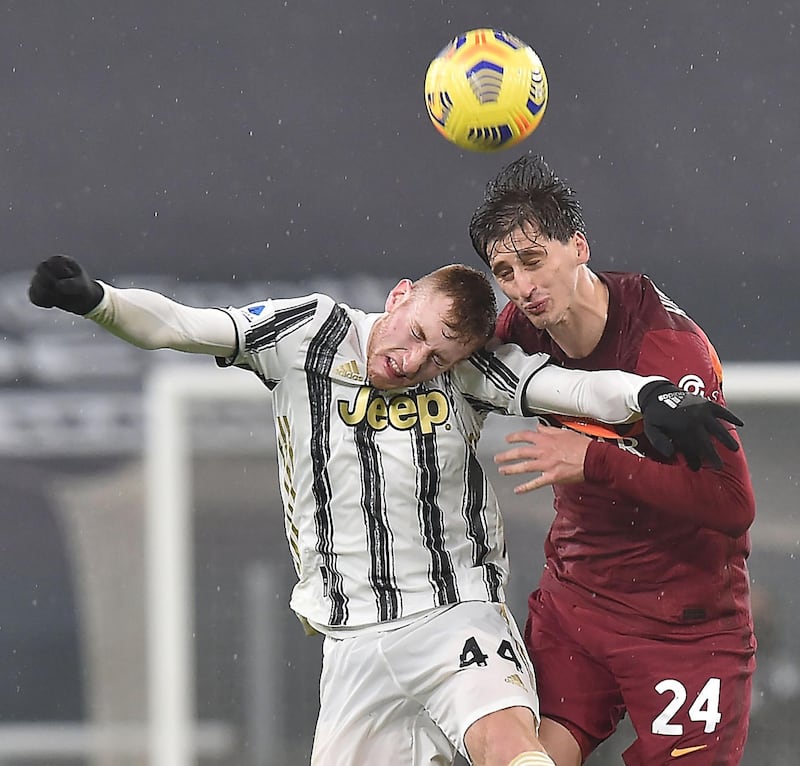 Juventus' Dejan Kulusevski  and Maresh Kumbulla of Roma challenge for a header. EPA
