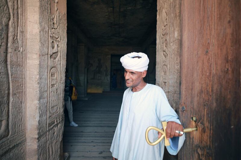 A guard stands outside the temple dedicated to Queen Nefertari at Abu Simbel, Egypt. Tourism in Egypt is affected by the Covid-19 pandemic. EPA