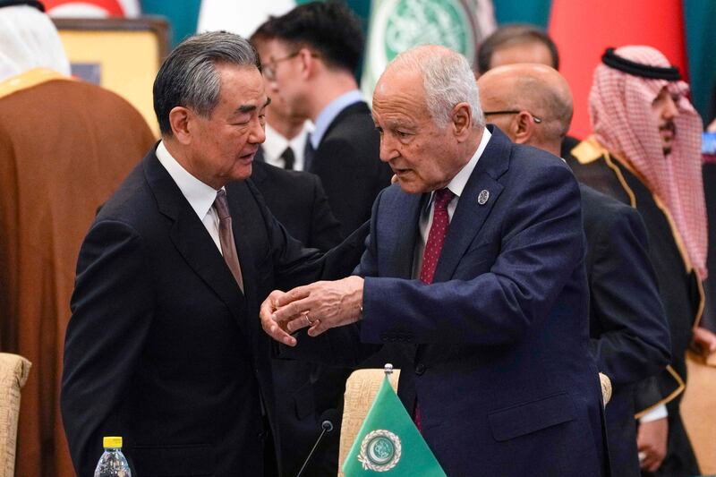 Chinese Foreign Minister Wang Yi talks with Arab League Secretary General Ahmed Aboul Gheit during the 10th Ministerial Meeting of China-Arab States Co-operation Forum in Beijing. AFP