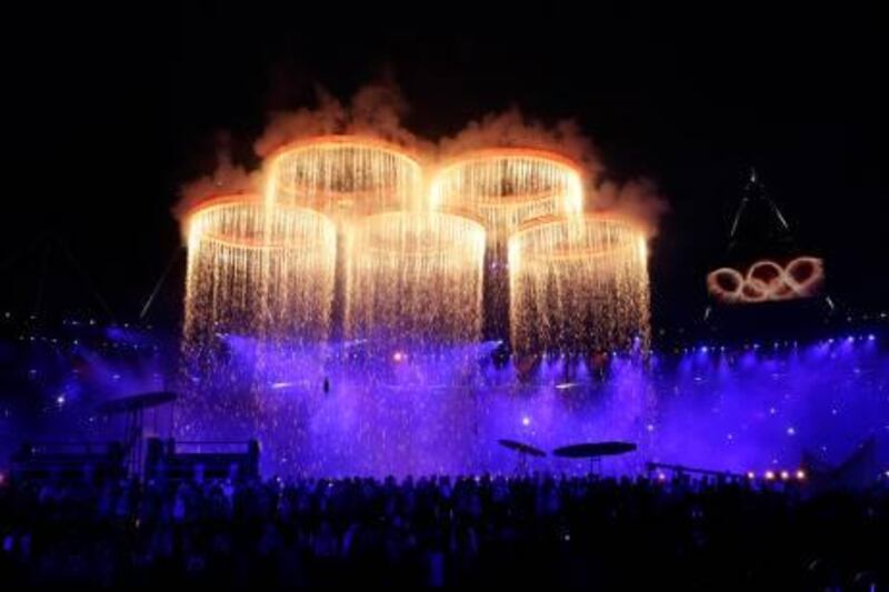 The Olympic rings are lit with pyrotechnics during the Opening Ceremony at the 2012 Summer Olympics, Friday, July 27, 2012, in London. (AP Photo/David Goldman) *** Local Caption ***  London Olympics Opening Ceremony.JPEG-0e26e.jpg