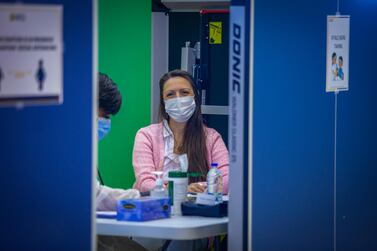 An Abu Dhabi private education staff member prepares to receive the Covid-19 vaccine during a drive organised by Adek. Courtesy: Abu Dhabi Department of Education and Knowledge