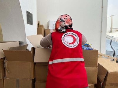 A Tunisian Red Crescent volunteer at the central headquarters collecting and organising donations made by Tunisians for people in Gaza. Ghaya Ben Mbarek / The National