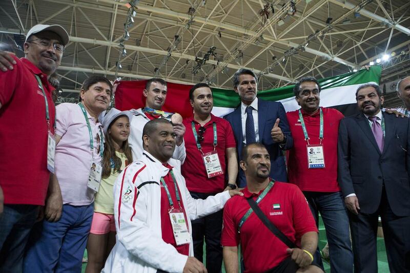 UAE judoka Sergiu Toma, fourth from left top row, and Naser Al Tamimi, third from right, celebrate with the UAE contingent at the 2016 Rio Olympics. Courtesy Gabriela Sabau