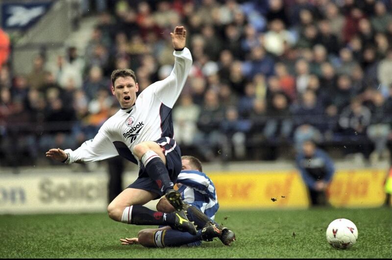 14 Mar 1998:  Alan Thompson of Bolton Wanderers is brought down  during an FA Carling Premiership match against Sheffield Wednesday at the Reebok Stadium in Bolton, England. Bolton Wanderers won the match 3-2. \ Mandatory Credit: Shaun  Botterill/Allsport