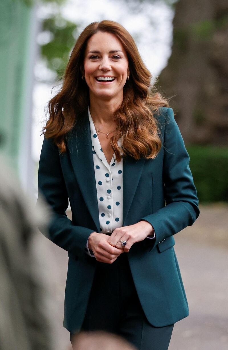 A forest green blazer paired with a green and white polka-dot blouse for a visit to Starbank Park to hear about the work of Fields in Trust on May 27.  Phil Noble / AFP