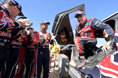 epa08135231 Dakar Rally 2020 winner in the car category Spanish Carlos Sainz (R) of Bahrain JCW X-Raid Team is applauded by second placed Nasser Al-Attiyah (C) of Qatar and others at the finish line of stage 12 between Shubaytah and Qiddiya, Saudi Arabia, 17 January 2020. EPA/BERNARD PAPON / LEQUIPE / POOL EDITORIAL USE ONLY