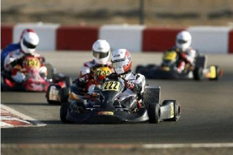 Racers gathered at Al Ain Raceway on Friday, October 1, 2010, to participate in the UAE Rotax Max Challenge kart race. Mohammed al Dhaheri (222) leads the pack during the DD2 qualifying race.