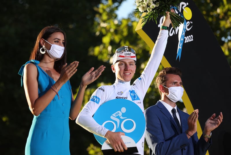 UAE Team Emirates rider Tadej Pogacar on the podium wearing the best young rider's white jersey. AFP