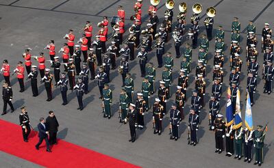 South Korean President Moon Jae-in attends a welcome ceremony with North Korean leader Kim Jong Un at the truce village of Panmunjom inside the demilitarized zone separating the two Koreas, South Korea, April 27, 2018.   Korea Summit Press Pool/Pool via Reuters