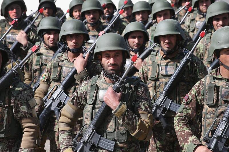 Soldiers with the Afghan National Army (ANA) graduate from basic training during a ceremony at the ANA’s combined fielding centre. Scott Olson / Getty / March 18, 2014