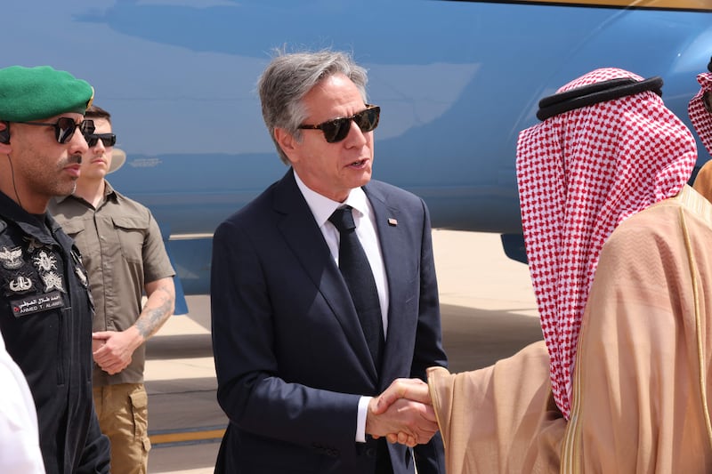 Mr Blinken is greeted by a Saudi official upon his arrival at the King Khalid International Airport in Riyadh. AFP