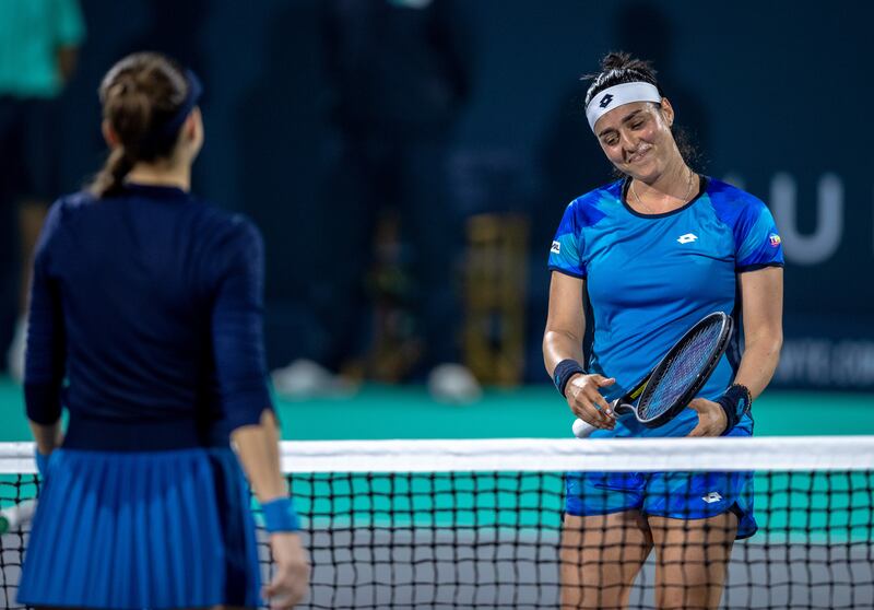 Ons Jabeur and Belinda Bencic greet each other at the net after their match at the Mubadala World Tennis Championship. Victor Besa / The National