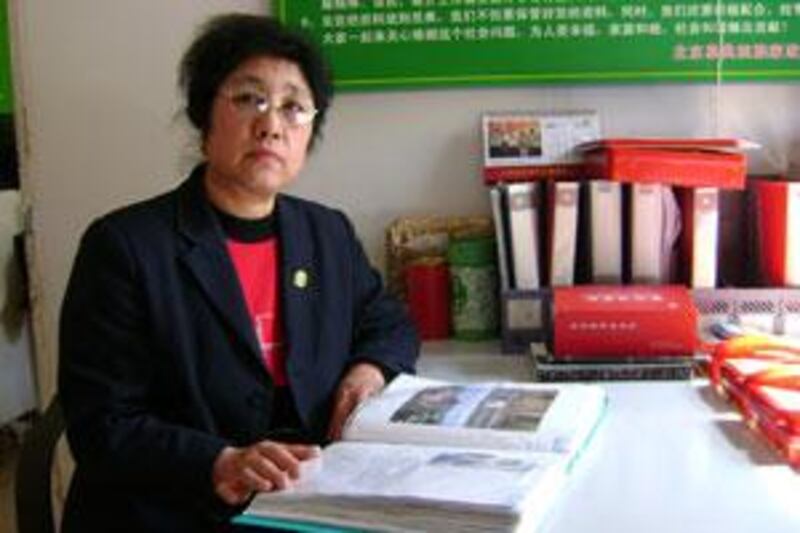 Man Rong Qin at work in her office where she runs a matchmaking service in Beijing for Muslims.