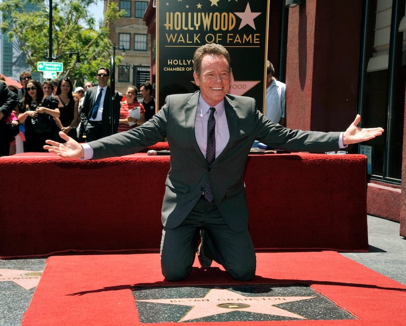 Actor Bryan Cranston poses atop his new star on the Hollywood Walk of Fame on Tuesday, July 16, 2013 in Los Angeles. (Photo by Chris Pizzello/Invision/AP) *** Local Caption ***  Bryan Cranston Honored with a Star on the Hollywood Walk of Fame.JPEG-01036.jpg
