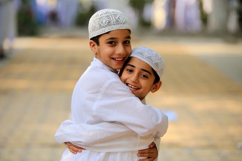 Pakistani Muslim children greet each other after Eid Al Fitr prayers in Peshawar, Pakistan, on April 22. EPA