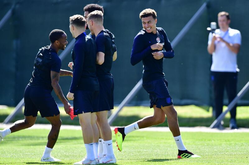 England midfielder Dele Alli, right, takes part in a training session in Repino on June 27. AFP