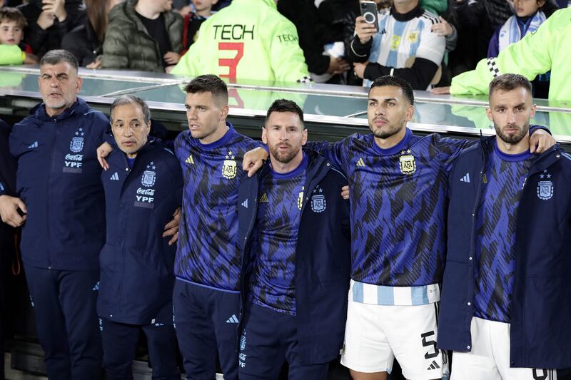 Argentina forward Lionel Messi and teammates sing the national anthem before kick off. AFP