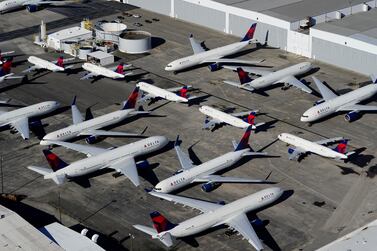  Delta Air Lines passenger planes are seen parked due to flight reductions because of the outbreak of the coronavirus. Global passenger air traffic will not return to pre-pandemic levels until 2024. Reuters. 