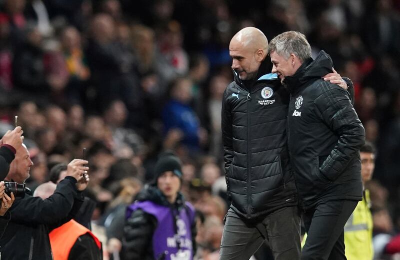 Manchester United manager Ole Gunnar Solskjaer with Manchester City manager Pep Guardiola at Old Trafford. AP