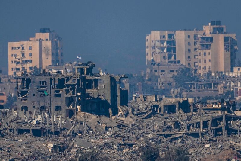 Israeli flags on the top of destroyed buildings in the Gaza Strip. AP 