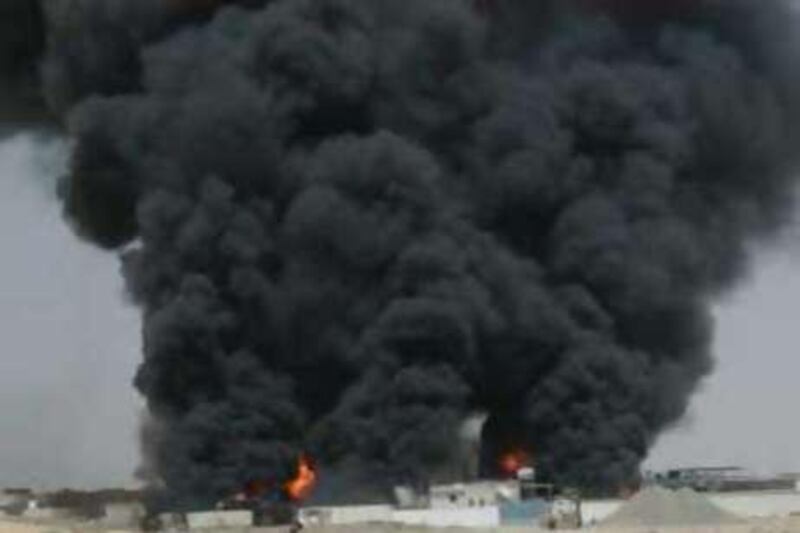 SHARJAH', UAE. 25TH SEPTEMBER 2008. This handout picture shows a fire at an oil depot in the Sajja area of Sharjah.                              