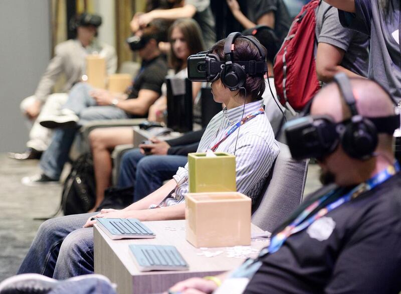 Attendees use Oculus Rift virtual reality headsets. Reuters 