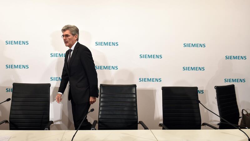 Joe Kaeser, CFO, leaves a press conference of the German industrial giant Siemens, ahead of the annual shareholder's meeting, at the Olympic hall in Munich, southern Germany, on January 31, 2018. 
German engineering giant Siemens said Wednesday that profits jumped in the first quarter, driven by rising demand for its products in areas ranging from renewable energy and trains to industrial robots. 
 / AFP PHOTO / CHRISTOF STACHE
