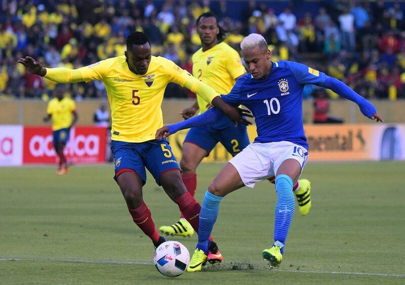 Brazil's Neymar, right, vies for the ball with Ecuador's midfielder Alex Ibarra. Rodrigo Buendia / AFP