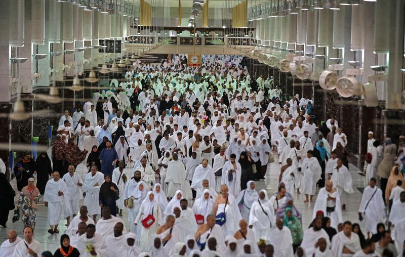 Mulism pilgrims leave after performing morning prayers at the Grand Mosque in Saudi Arabia's holy city of Mecca on August 8, 2019, prior to the start of the annual Hajj pilgrimage in the holy city. Muslims from across the world gather in Mecca in Saudi Arabia for the annual six-day pilgrimage, one of the five pillars of Islam, an act all Muslims must perform at least once in their lifetime if they have the means to travel to Saudi Arabia. / AFP / Abdel Ghani BASHIR

