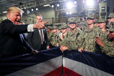 US President Donald Trump greets sailors after a speech aboard the USS Wasp at JMSDF Yokosuka base in Yokosuka, south of Tokyo. Reuters