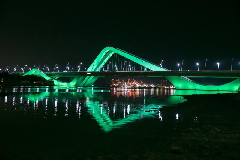 Sheikh Zayed Bridge is lit up in green to coincide with Abu Dhabi Sustainability week. Courtesy General Secretariat of the Executive Council