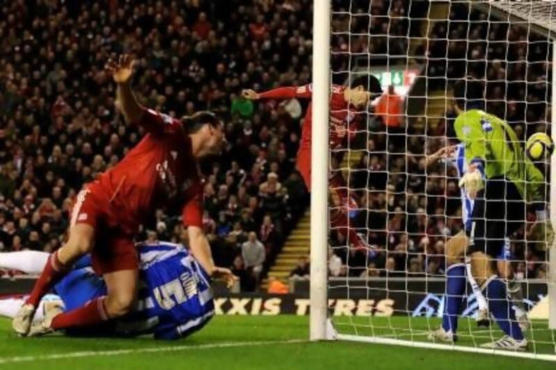 Luis Suarez, centre, scored Liverpool’s sixth goal, set-up by Andy Carroll, during the FA Cup Fifth Round match in the 6-1 win over Brighton & Hove Albion at Anfield.