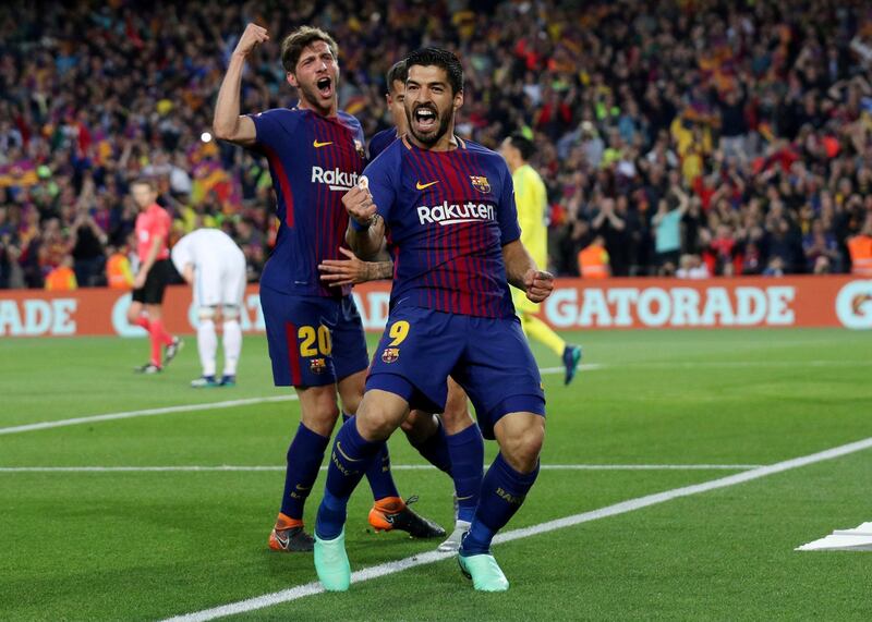 Barcelona's Luis Suarez celebrates scoring their first goal with Sergi Roberto. Albert Gea / Reuters