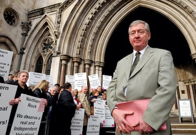Dennis Grainger, leader of the North East campaign, with shareholders from Northern Rock as they protest outside the High Court in London.