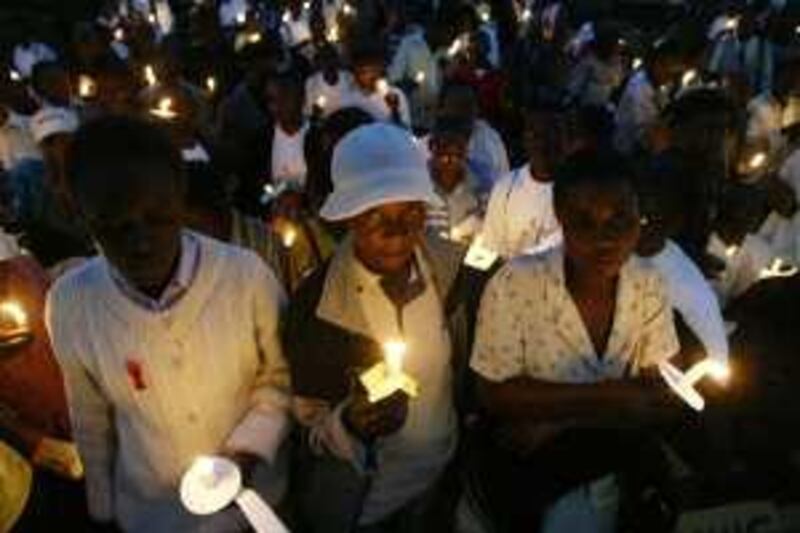  Hundreds of people in Zimbabwe throng the  Town  House in Harare, Friday, May, 19, 2006, in a  ceremony in honour of people who have died of HIV and AIDS. Zimbabwe has one of the highest HIV and AIDS infection rates in Africa. (AP Photo)