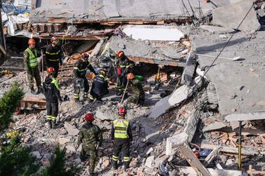 Italian search and rescue workers look for survivors stuck under the rubble of a collapsed building. AFP