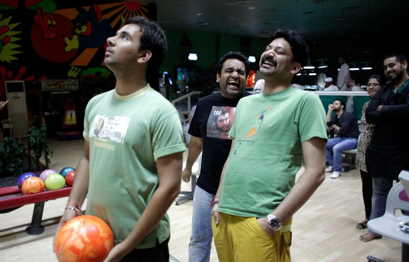 August 15, 2011 (Umm al Quwain) Tapesh Vashisth, left.  Rahul Dutt and Anuvrat Gaurav, all from India spend the evening at the Palma Bowling Ally in Umm al Quwain August 15, 2011. (Sammy Dallal / The National)