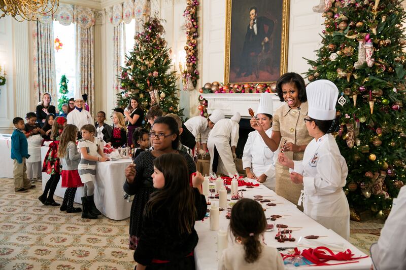 Ms Obama is joined by Ms Comerford, right, and children of military families for a craft project during the 2012 holiday decorations press preview. Photo: Official White House Photo / Chuck Kennedy