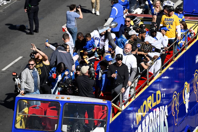 Los Angeles Rams offensive lineman Andrew Whitworth holds up the Vince Lombardi Super Bowl trophy during the team's victory parade. AP