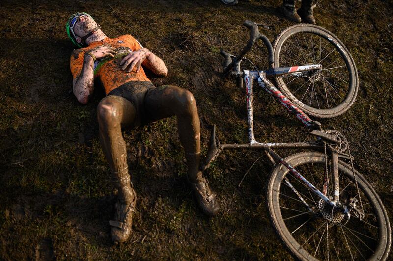 A rider recovers after competing in the Junior Men race of the British Cycling National Cyclo-Cross Championships at Shrewsbury.  AFP