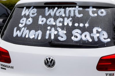 FILE PHOTO: A message written on a car window is pictured as Florida teachers, whose unions are against their members returning to school, hold a car parade protest in Land O' Lakes, Florida, U.S. July 21, 2020.  REUTERS/Octavio Jones/File Photo
