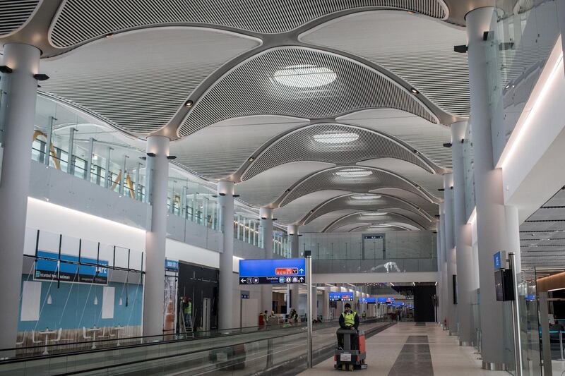 An airport employee works to put finishing touches to the completed hall "B" section. Getty Images