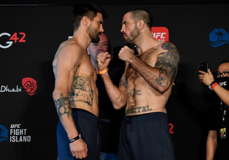 ABU DHABI, UNITED ARAB EMIRATES - JANUARY 15: (L-R) Opponents Carlos Condit and Matt Brown face off during the UFC weigh-in at Etihad Arena on UFC Fight Island on January 15, 2021 in Abu Dhabi, United Arab Emirates. (Photo by Jeff Bottari/Zuffa LLC)