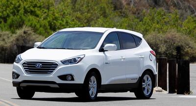 A Hyundai Tucson hydrogen fuel cell electric vehicle (FCEV) is driven during a photo op in Newport Beach, California June 9, 2014. The Tucson FCEV will be released this week and represents the next generation of electric vehicles that creates its own electricity, on-board, from hydrogen with zero greenhouse-gas emissions, emitting only water vapor. The car will offer a driving range over 250 miles and is capable of refueling in less than 10 minutes with a hose and nozzle similar to gasoline fueling.  REUTERS/Alex Gallardo  (UNITED STATES - Tags: TRANSPORT ENERGY BUSINESS) - GM1EA6A0GKA01