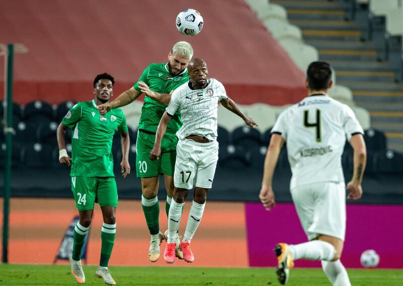 Arabian Gulf League final round: Al Jazira v Khorfakkan at Mohamed bin Zayed stadium. Serero of Jazira battles for a header with Bruno Lamas of Khorfakkan during the first half of the game on May 11th, 2021. Victor Besa / The National.
