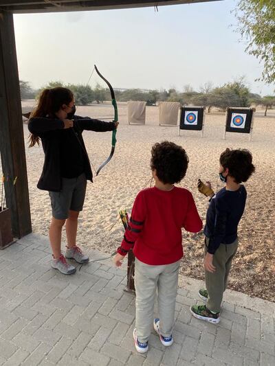 Samia Badih partakes in archery on Sir Bani Yas Island with her children. Courtesy Samia Badih