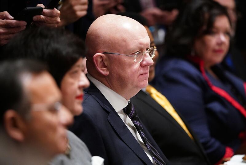 Russia's Representative to the UN Vassily Nebenzia (C) takes part in a luncheon with United Nations Security Council permanent representatives in the Cabinet Room of the White House in Washington, DC on December 5, 2019. / AFP / MANDEL NGAN
