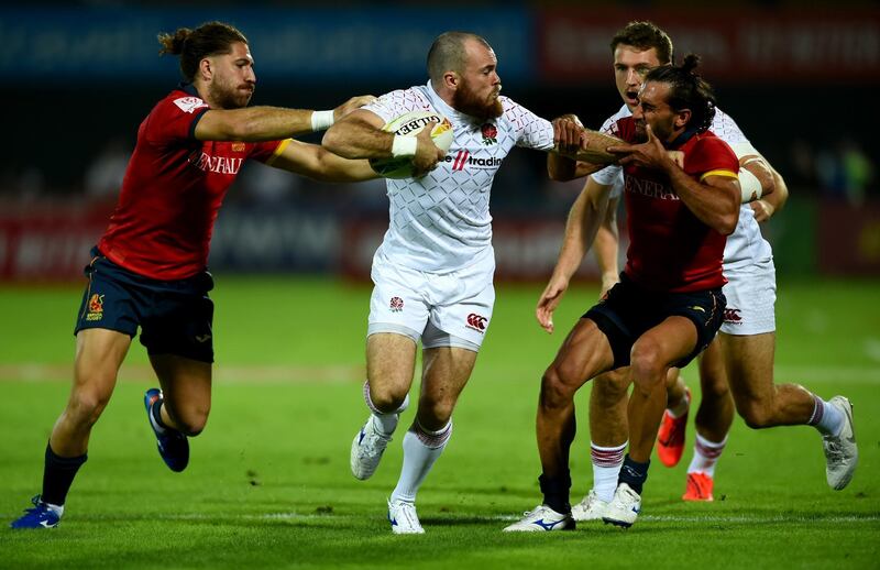 Tom Bowen of England tackles Spain players at The Sevens Stadium in Dubai. Getty Images